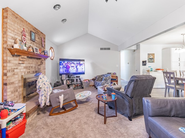 living room featuring carpet floors, a fireplace, and vaulted ceiling