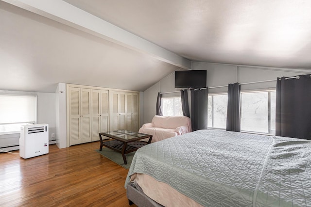 bedroom with hardwood / wood-style floors, multiple closets, a baseboard heating unit, and lofted ceiling with beams