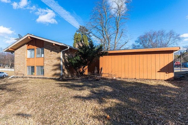 view of home's exterior featuring a yard