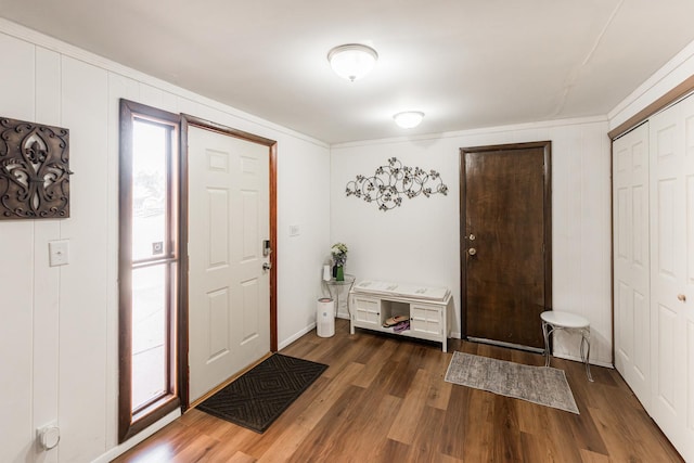 entryway with dark hardwood / wood-style flooring