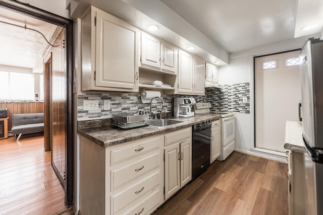 kitchen featuring white range with electric stovetop, dishwasher, backsplash, dark hardwood / wood-style flooring, and sink