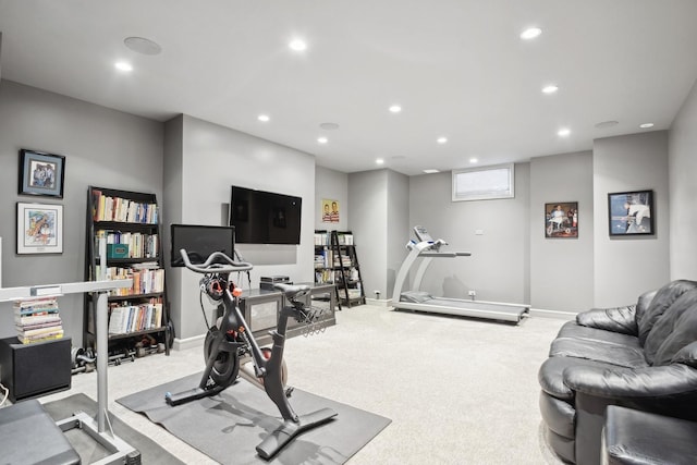 workout room featuring light colored carpet