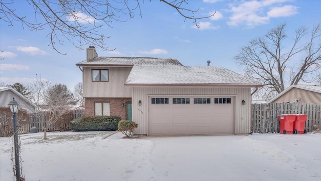 view of front of house featuring a garage, brick siding, a chimney, and fence