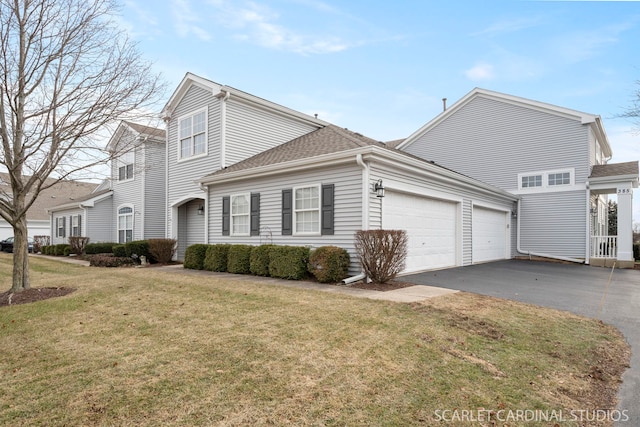 front of property featuring a garage and a front lawn