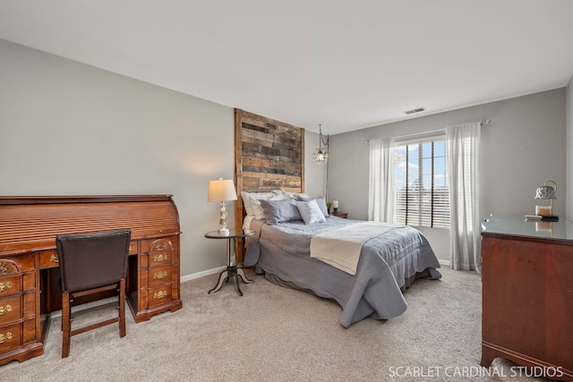 bedroom featuring light colored carpet