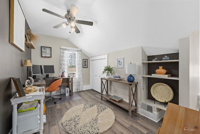 office space with lofted ceiling, wood-type flooring, and ceiling fan