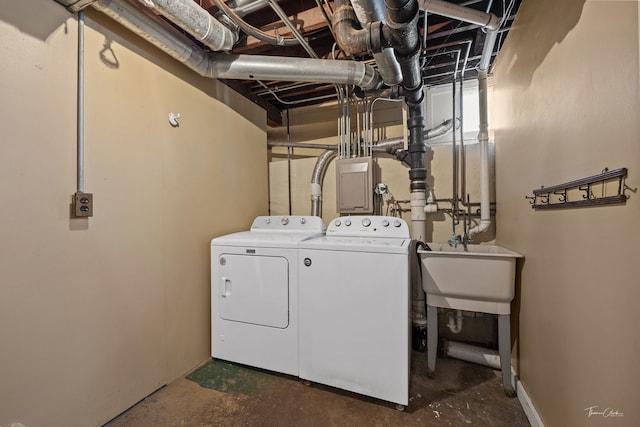 washroom with sink and washer and clothes dryer