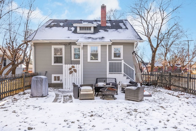 snow covered property featuring a fire pit