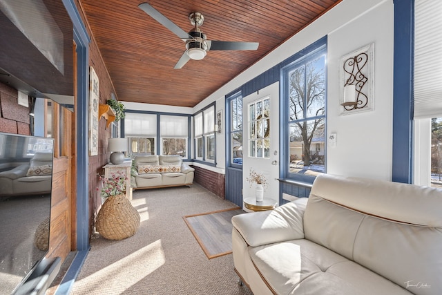 sunroom / solarium with wooden ceiling and ceiling fan