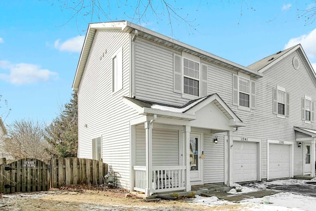 view of front of property with a garage and a porch