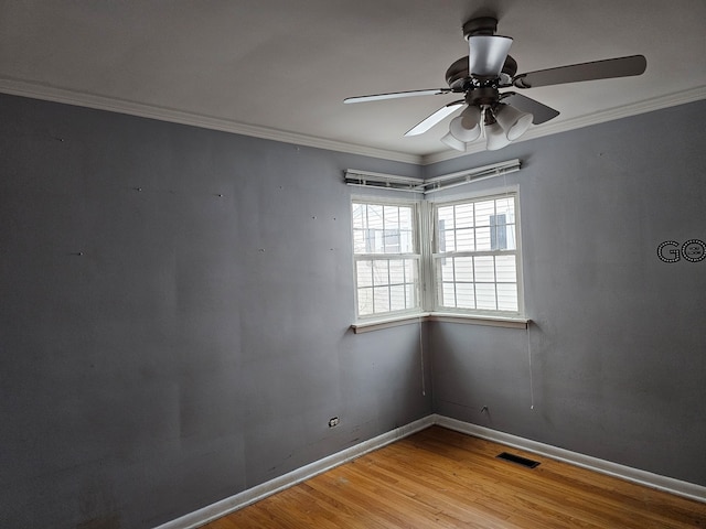 spare room with ornamental molding, light hardwood / wood-style floors, and ceiling fan