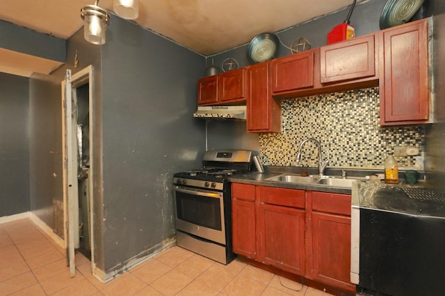 kitchen featuring sink, decorative backsplash, stainless steel range with gas stovetop, and light tile patterned floors