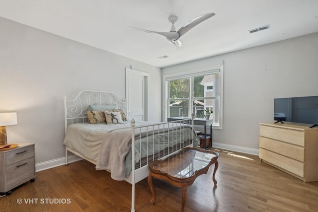 bedroom featuring dark wood-type flooring and ceiling fan