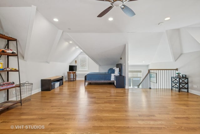 bedroom with lofted ceiling and light hardwood / wood-style floors