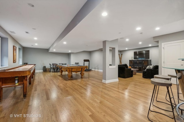 game room with pool table and light hardwood / wood-style flooring