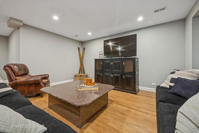 living room with light hardwood / wood-style floors