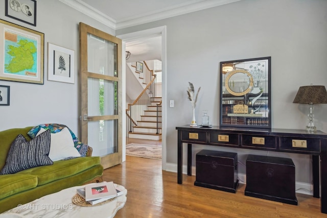 living room with crown molding and wood-type flooring