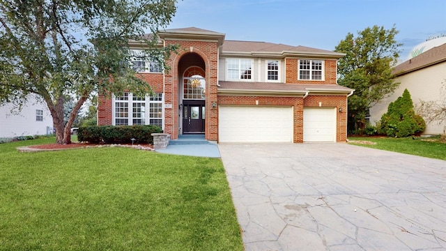 view of front of house featuring a garage and a front yard