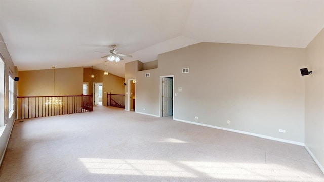 carpeted empty room with vaulted ceiling and ceiling fan