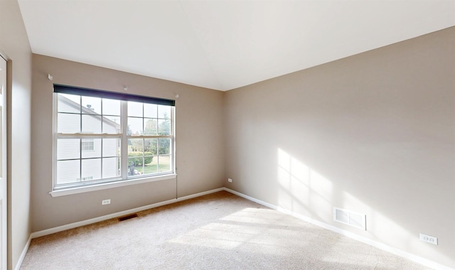 spare room with light colored carpet