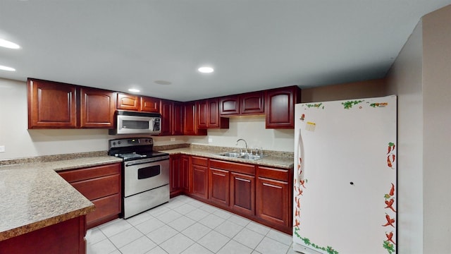 kitchen featuring sink, light tile patterned floors, and appliances with stainless steel finishes