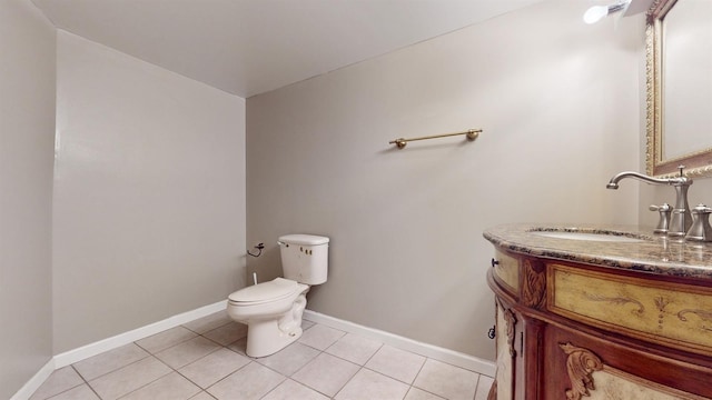 bathroom with vanity, toilet, and tile patterned flooring