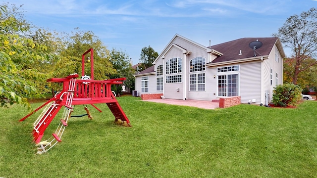 exterior space with a yard, central AC unit, and a patio area