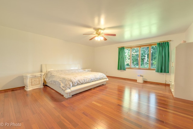 bedroom featuring hardwood / wood-style flooring and ceiling fan