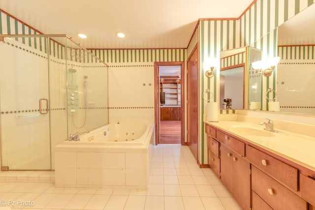 bathroom featuring recessed lighting, vanity, a shower stall, a tub with jets, and tile patterned floors