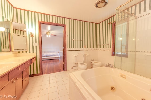 bathroom featuring tile patterned flooring, toilet, visible vents, a tub with jets, and wallpapered walls