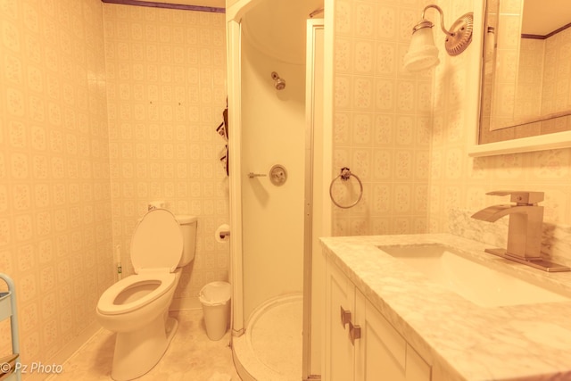 bathroom featuring wallpapered walls, toilet, tile patterned flooring, vanity, and a shower stall