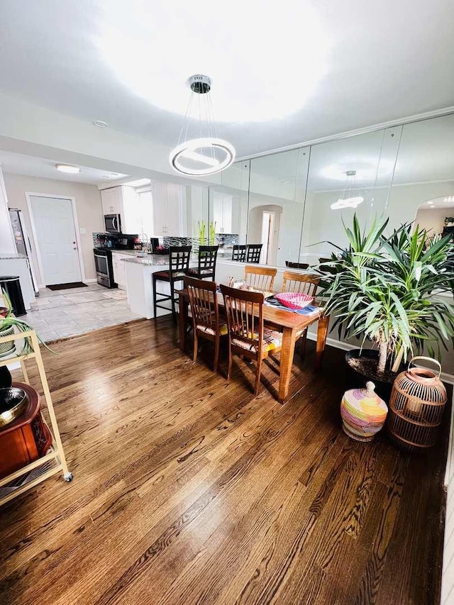 dining area with light wood-type flooring