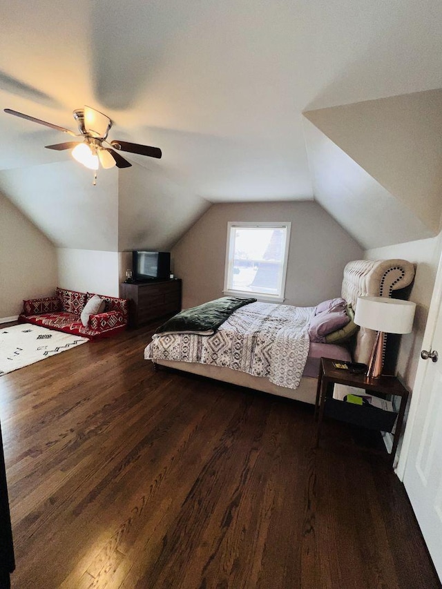 bedroom featuring lofted ceiling, dark wood-type flooring, and ceiling fan