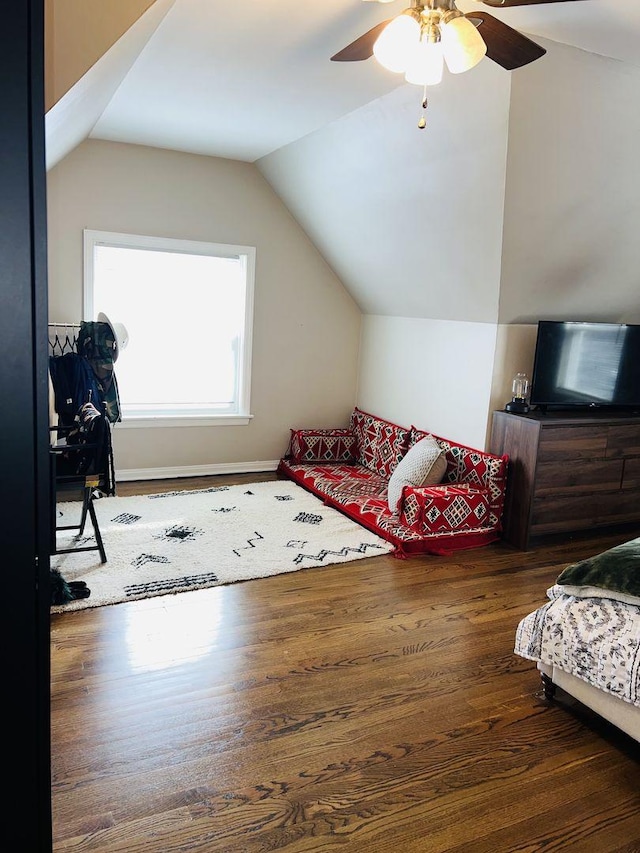 bedroom featuring lofted ceiling, dark hardwood / wood-style floors, and ceiling fan