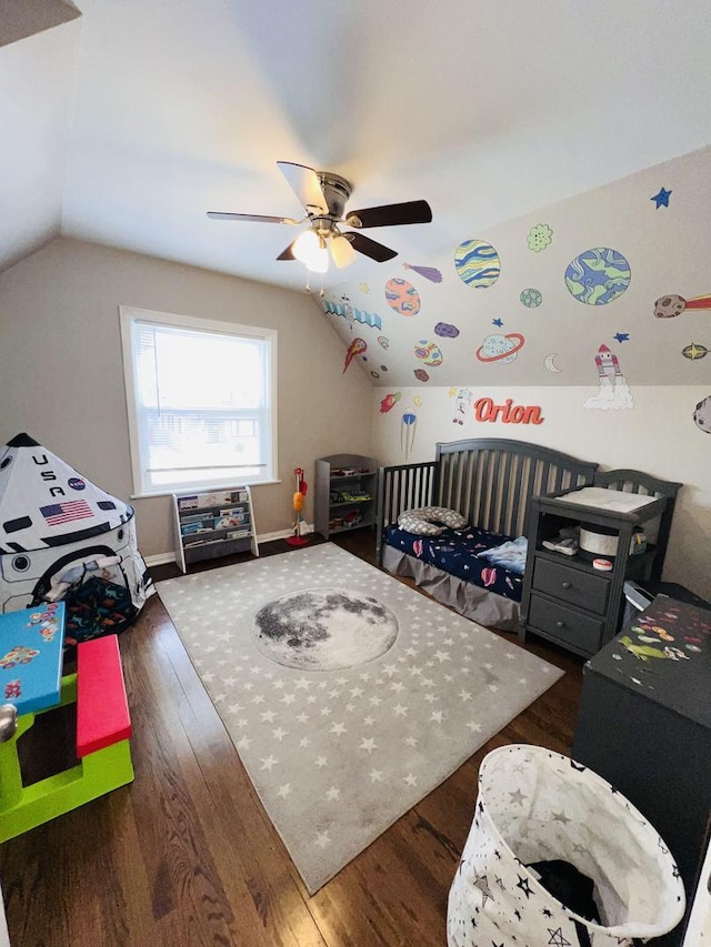 bedroom featuring dark wood-type flooring, ceiling fan, and lofted ceiling