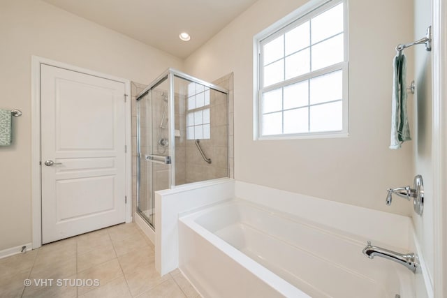 bathroom featuring tile patterned floors and shower with separate bathtub