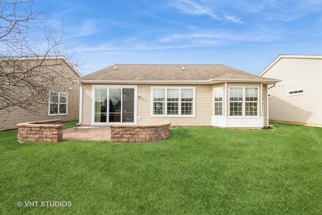 rear view of house featuring a patio area and a lawn