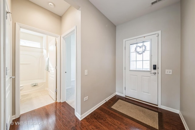 entrance foyer with dark hardwood / wood-style floors