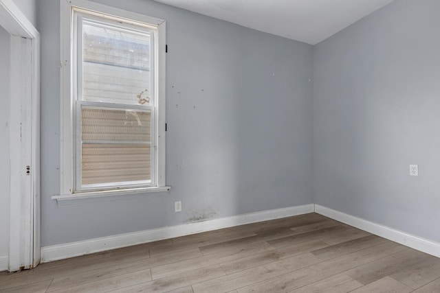 spare room featuring light hardwood / wood-style floors