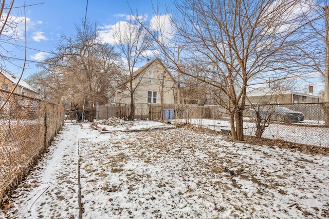 view of yard covered in snow