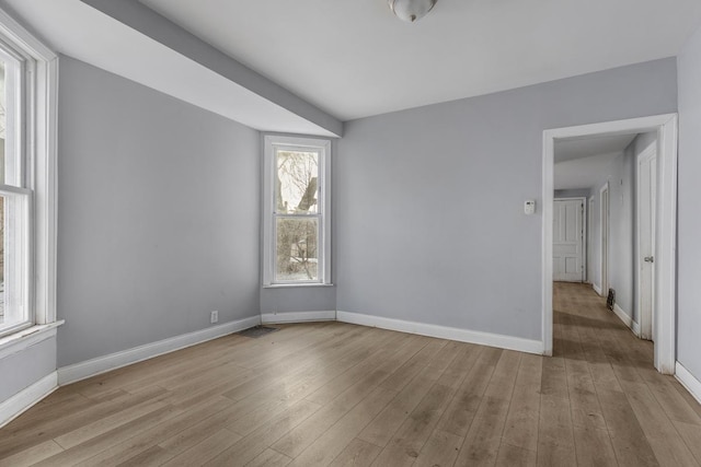 unfurnished room featuring light wood-type flooring