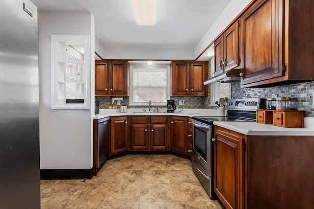 kitchen featuring sink, backsplash, and stainless steel appliances