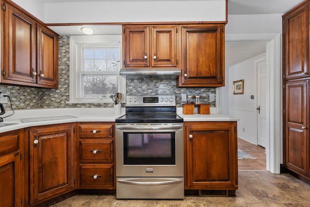 kitchen with tasteful backsplash and stainless steel electric range