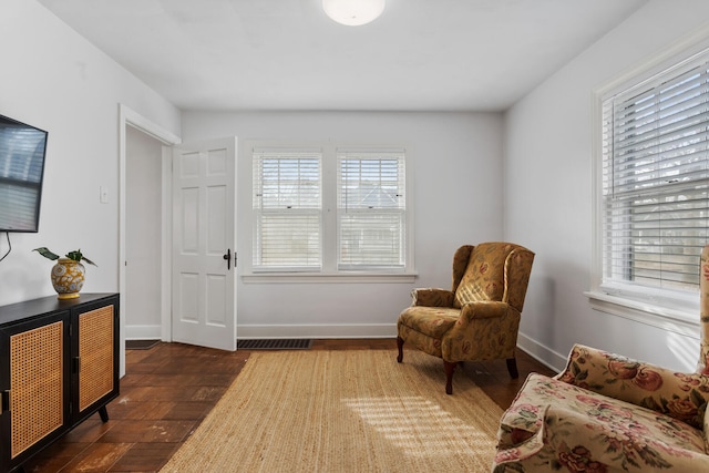 sitting room featuring dark wood-type flooring