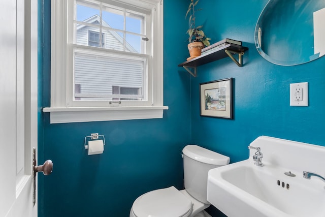 bathroom with toilet and sink