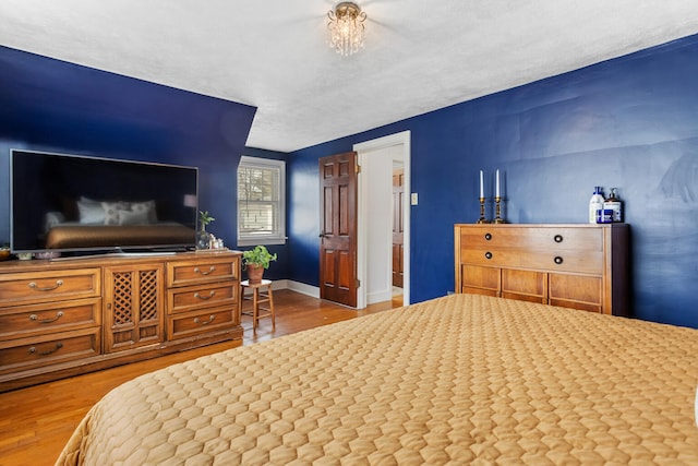 bedroom with hardwood / wood-style floors