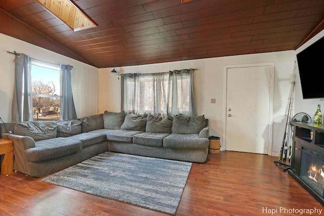 living room featuring dark hardwood / wood-style floors, vaulted ceiling, and wooden ceiling