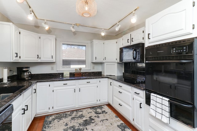 kitchen with dark hardwood / wood-style floors, black appliances, dark stone counters, and white cabinets