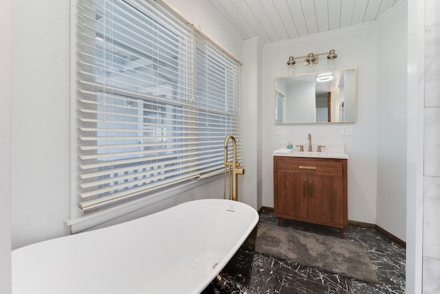 bathroom featuring vanity, a bath, and crown molding