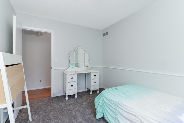 bedroom with dark carpet